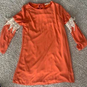 Orange long sleeve dress.